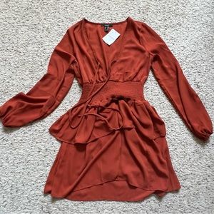 Forever 21 Dress, with layered bottom. Rust colored and size Medium